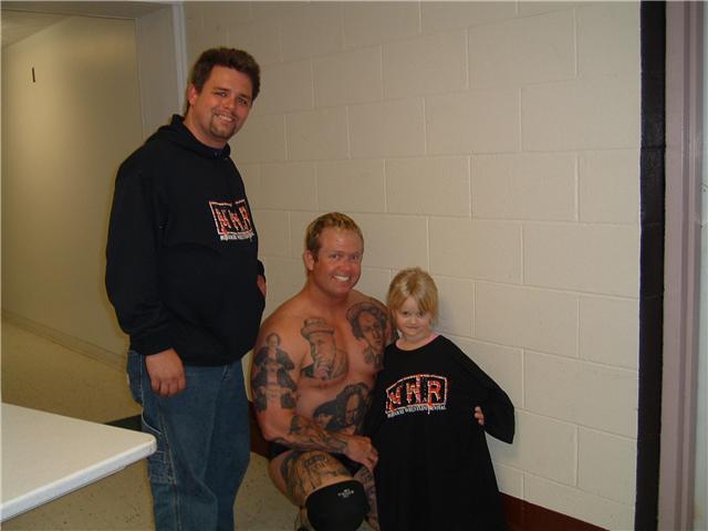 [From left to right] Head of Wrestler & Promoter Relations Brian "Flair" Kelley, AAPW wrestler "Curly", and his daughter Dani Summers.