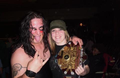 Destiny Diamond holds the Heavyweight Title of the then-champion Jeremy Lightfoot prior to her training. "[Jeremy Lightfoot] taught me the basics, and then he taught me how to jump off the ropes, do some high flying stuff," Destiny said.