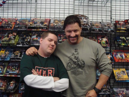 Paul Morad, the winner of the MWR T-shirt raffle poses with Al Snow, who appeared at The Fan Shop on Jan. 30.
