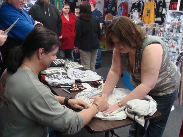 Superfan and Former Independent Valet Barbie Shultz has her autograph jacket signed by Al Snow.
