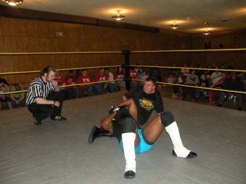 Brian Scrilla keeps Eric Allen grounded. (Photo Credit Brian Kelley)