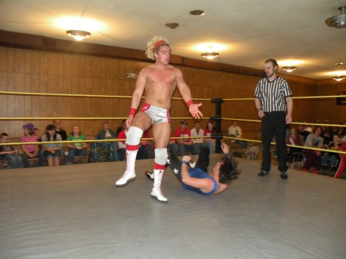 Juice Robinson sends a message to Hunter Mathews  that this is his night with a powerful shoulder block(Photo Credit Brian Kelley)