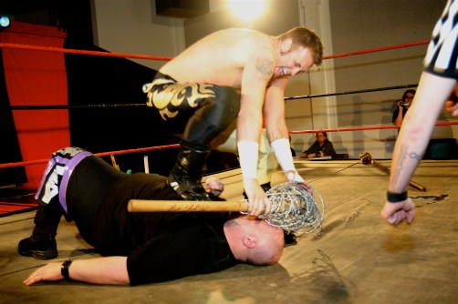 Jeremy Wyatt went to all expense to keep his LWA Title against Jordan Lacey  in their “Fans bring the weapons match” ( Photo Credit Mike Van Hoogstraat) 