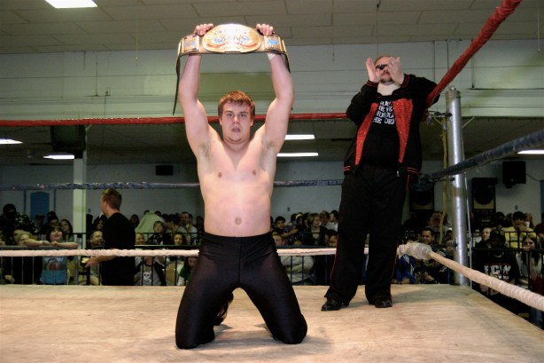 Travis Cook is elated that Dave Vaughn is still the Champion. (Photo Credit Mike Van Hoogstraat)