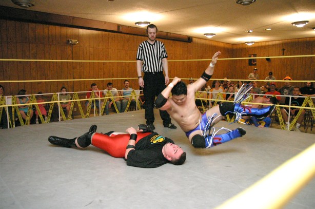 Kwong punishes Scrilla with a punishing elbow (Photo Credit: Mike Van Hoogstraat)