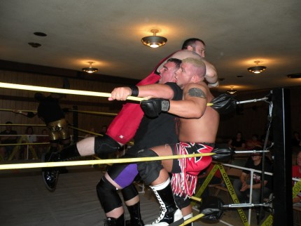 Maddog McDowell stinger splashes Brian Scrilla and Bailey Mannix in the corner (Photo Credit Brian “Flair” Kelley)