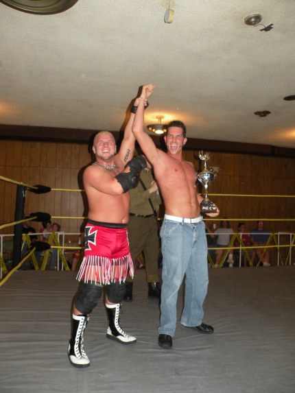 Bailey Mannix celebrates with the first ever MECW Great Plains Trophy Battle Royal Champion Ryan Slade 