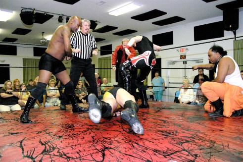 Shaft and newest Connection member Sean Vincent puts the boots to Vaughn who won by DQ(Photo Credit Michael R Van Hoogstraat)