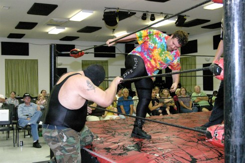 Bobby D tries to keep The Big Texan from returning to the ring. (Photo Credit Michael R Van Hoogstraat)