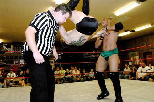 Dingo gets an assist from Ref Eric Davis.(Photo Credit Michael R Van Hoogstraat)