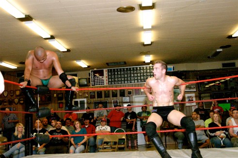 In trouble Dingo, stops Cage by hitting the ropes. (Photo Credit Michael R Van Hoogstraat)