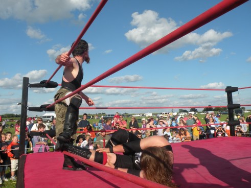 Always unorthodox, Neil brings Mephisto down to his size by taking out his legs. (Photo Credit Brian “Flair” Kelley)