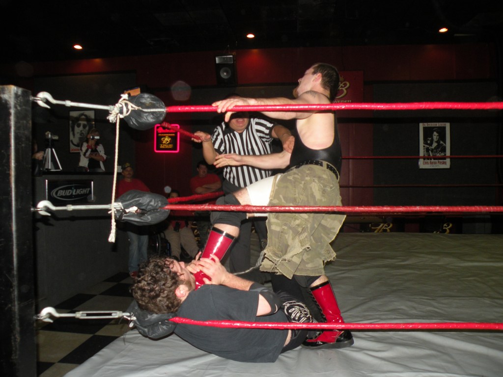 PWE 10-6-2009 045 Neil Diamond Cutter puts the boots to Markus Crane.(Photo credit Brian “Flair” Kelley)