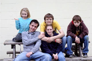 Tim Miller with his family. Photo credit Michael VanHoogstraat
