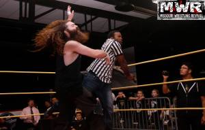 Referee Mike Outlaw hit champion Jake Dirden with the belt after Dirden throttled Outlaw, Oct. 3, 2015. Photo: Brian Kelley